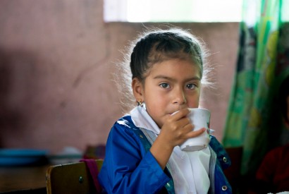 Angie Galvez sips her drink after enjoying her meal provided in rural Guatemala. USAID provides funding for school meals (Food for Education) in some of the most impoverished and malnurished areas. Photo: Joe Molieri / Bread for the World