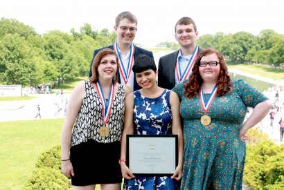Maria Rose Belding (bottom center) poses with the rest of the MEANS Database team at the Lincoln Memorial after receiving The President’s Volunteer Service Award. Photo Courtesy of Matt Waskiewiczs.