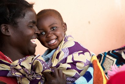 In rural Zambia, Dcsco Muyanda shares a moment of laughter with her son Berty. Photo: Joe Molieri / Bread for the World 