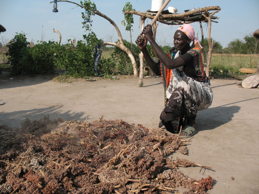 Dabora Nyibol, a returned refugee in South Sudan, prepares sorghum, a staple in her country. Photo by Stephen H. Padre/Bread for the World